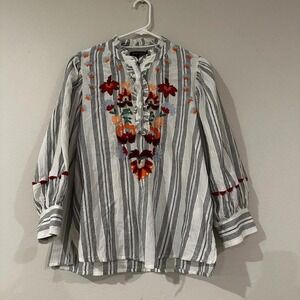 Size M blouse with intricate floral embroidery on front timeless striped pattern